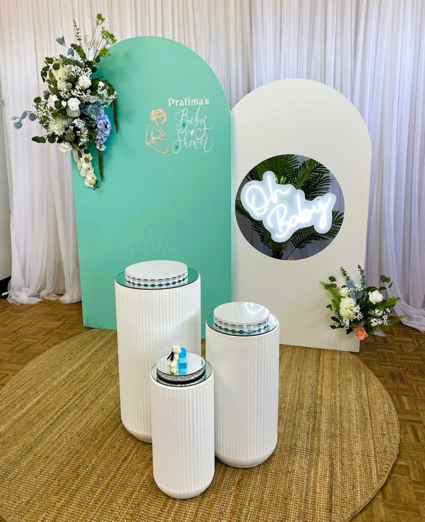 Chic green and white baby shower backdrop with floral arrangements by Saraya D Decor Adelaide