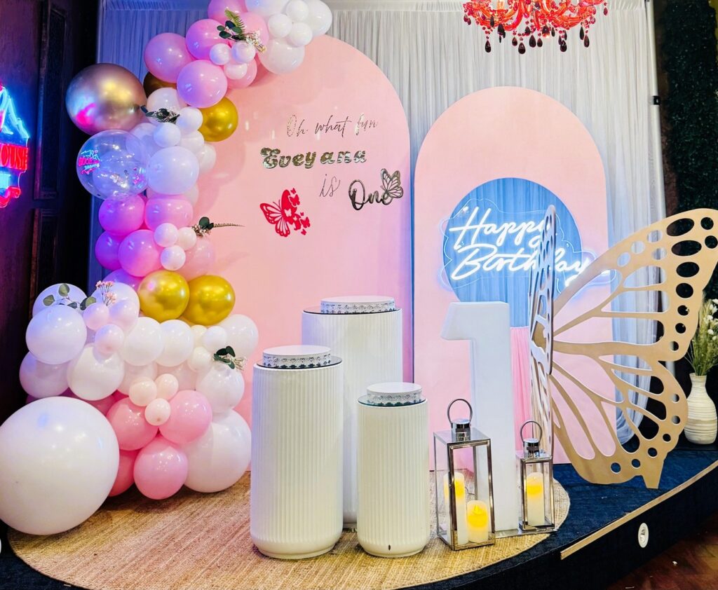 Pink and white first birthday balloon backdrop with butterfly decor by Saraya D Decor Adelaide